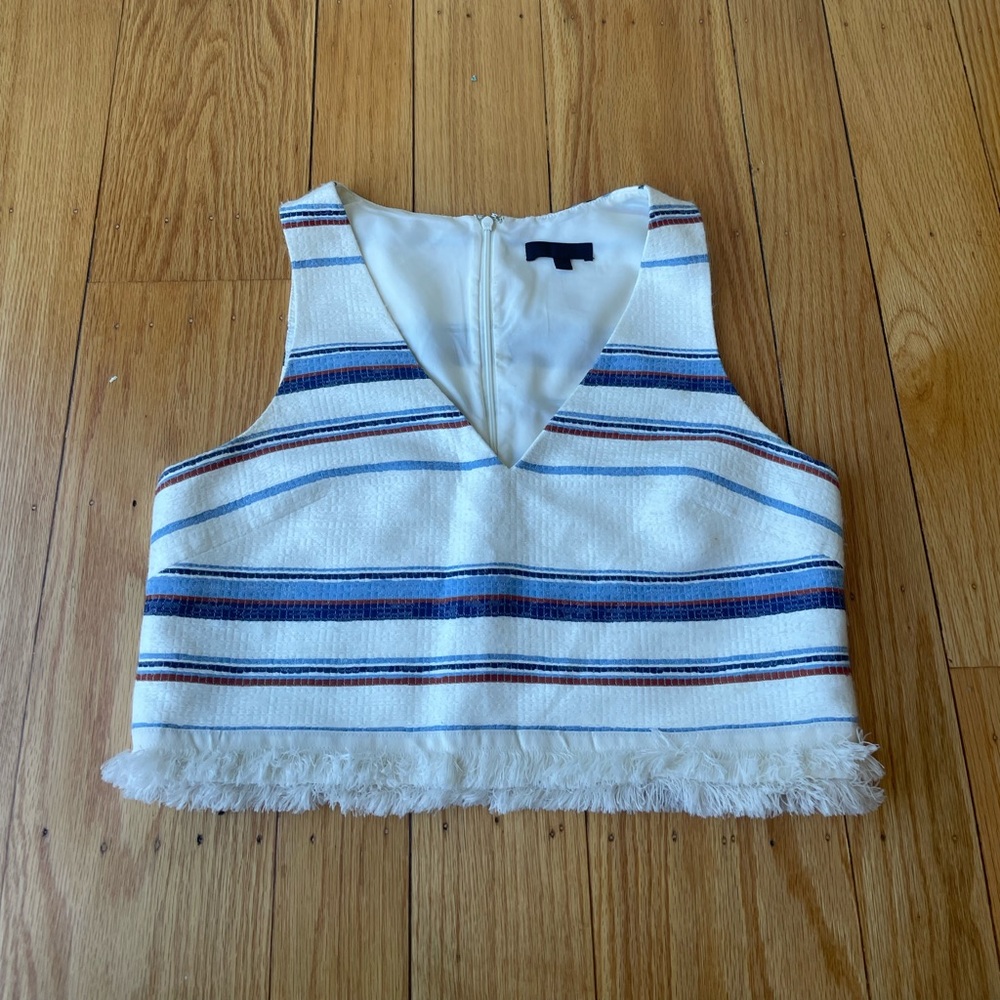 Crop top. Size small. Fringe at bottom.